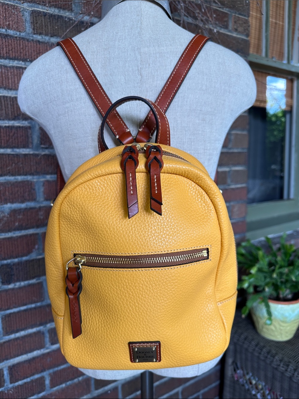Dooney & Bourke Ronnie small pebbled leather back pack in Dandelion yellow
